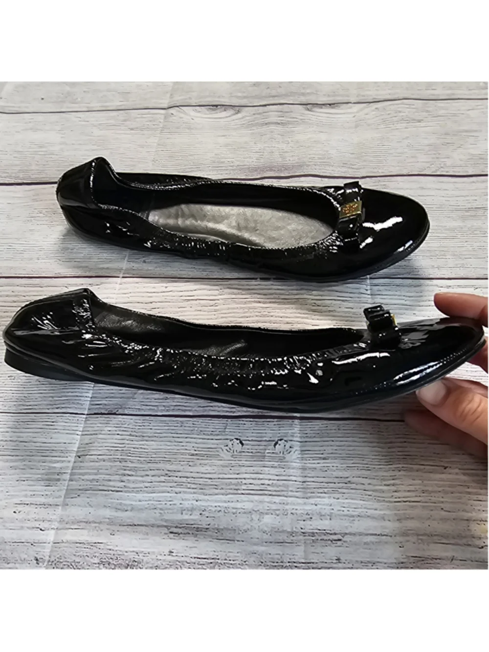 Tory Burch 10M shiny black ballerina flats with black and gold bow accent